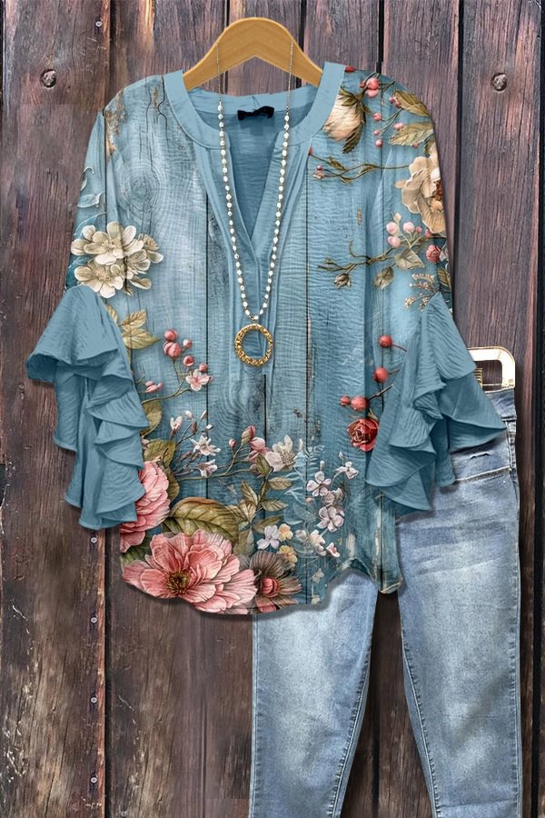 Blauwe blouse met 3D-bloemenprint