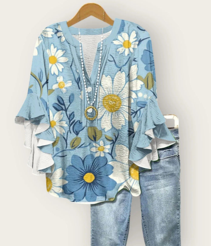 Blauwe blouse met 3D-bloemenprint
