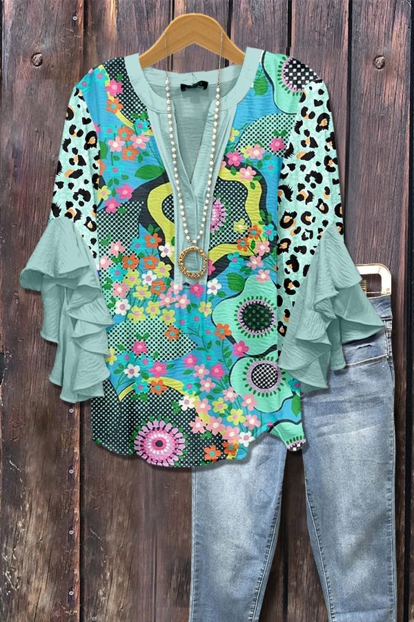Blauwe blouse met stippen en 3D-bloemenprint